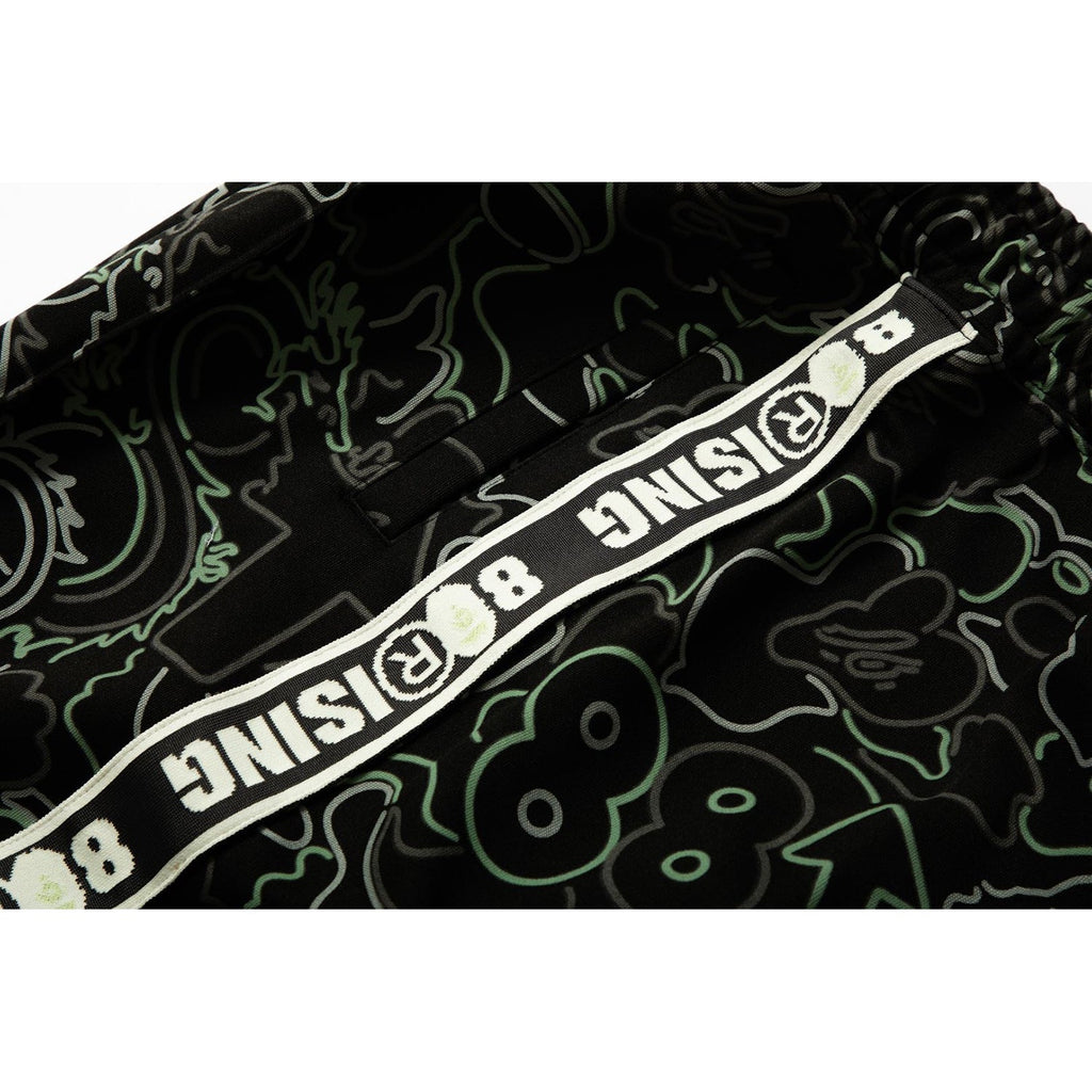 BAPE X 88RISING GLOW IN THE DARK CAMO TRACK PANTS MENS